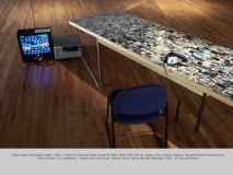 “data dump: information table” 1991, C-prints of thermal video prints UP 5000, table 238 x 82 cm, glass, chair, Umatic video by Georg Mühleck with sound by Pierre Dostie, 1/1; exhibition: “Copies non conformes”, Maison de la culture Mercier, Mont