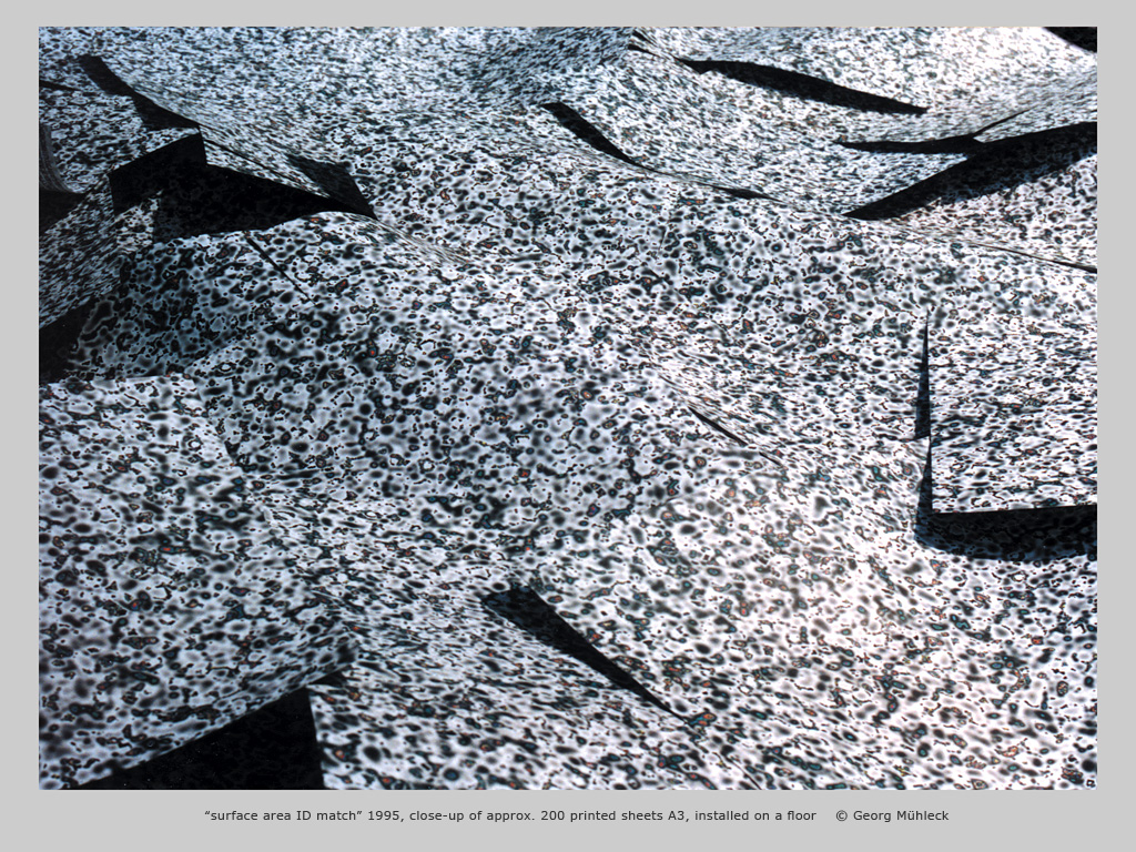 “surface area ID match” 1995, close-up of approx. 200 printed sheets A3, installed on a floor    © Georg Mühleck